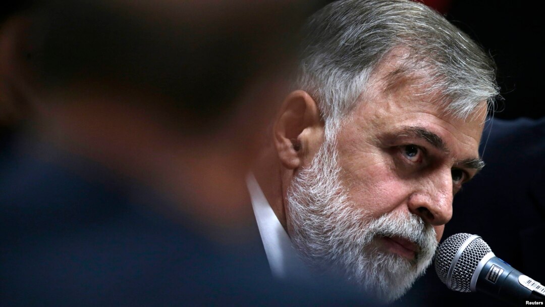 Former director of Brazil's state-run Petrobras oil company, Paulo Roberto Costa, reacts during a congressional committee that is investigating allegations of corruption at Brazilian state-run oil company Petroleo Brasileiro SA, in Brasilia, Dec. 2, 2014.