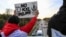 Opponents of the Keystone XL pipeline demonstrate on the Dodge Street pedestrian bridge during rush hour in Omaha, Neb., Nov. 1, 2017. The Nebraska Public Service Commission has until Nov. 23 to decide whether to approve or reject a proposed state route f