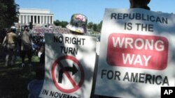 Protesters hoping Democrats will retain control of Congress after the November elections listen to speeches at the Lincoln Memorial.