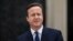 British Prime Minister David Cameron at 10 Downing Street in London, as he makes a speech after arriving back from visiting Britain's Queen Elizabeth II, March 30, 2015. 