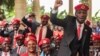 FILE - Singer turned politician Robert Kyagulanyi, also known as Bobi Wine, gestures during a press conference, held at his home in Magere in the outskirts of Kampala, July 24, 2019. 