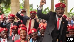 FILE - Singer turned politician Robert Kyagulanyi, also known as Bobi Wine, gestures during a press conference, held at his home in Magere in the outskirts of Kampala, July 24, 2019. 