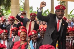 FILE - Singer turned politician Robert Kyagulanyi, also known as Bobi Wine, gestures during a press conference, held at his home in Magere in the outskirts of Kampala, July 24, 2019.