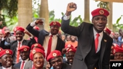 FILE - Singer turned politician Robert Kyagulanyi, also known as Bobi Wine, gestures during a press conference, held at his home in Magere in the outskirts of Kampala, July 24, 2019. 