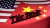FILE - The TikTok logo is placed on the U.S. and Chinese flags in this illustration.