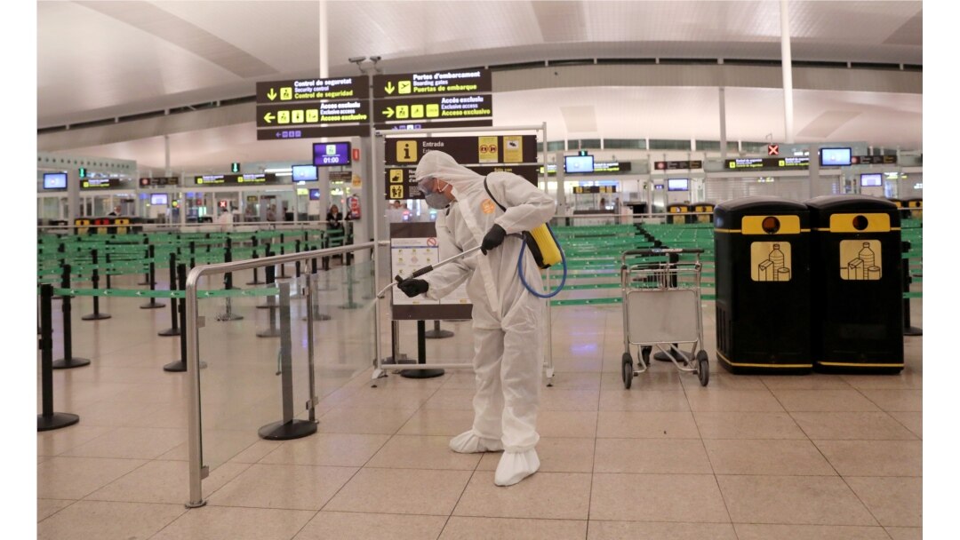 A member of the Military Emergency Unit disinfects the Josep Tarradellas Barcelona-El Prat Airport during a partial lockdown, part of a 15-day state of emergency to combat the coronavirus, in Barcelona, Spain, March 19, 2020.