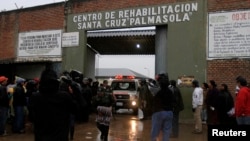 FILEL - Relatives of inmates wait for news at the entrance of Palmasola Penitentiary Complex in the outskirts of Santa Cruz, Aug. 23, 2013. Pope Francis will visit Bolivia's most notorious prison on July 10, 2015.