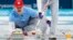 Second Matt Hamilton of the U.S. delivers the stone, Feb. 24, 2018, in the men's curling final against Sweden in Gangneung, South Korea.