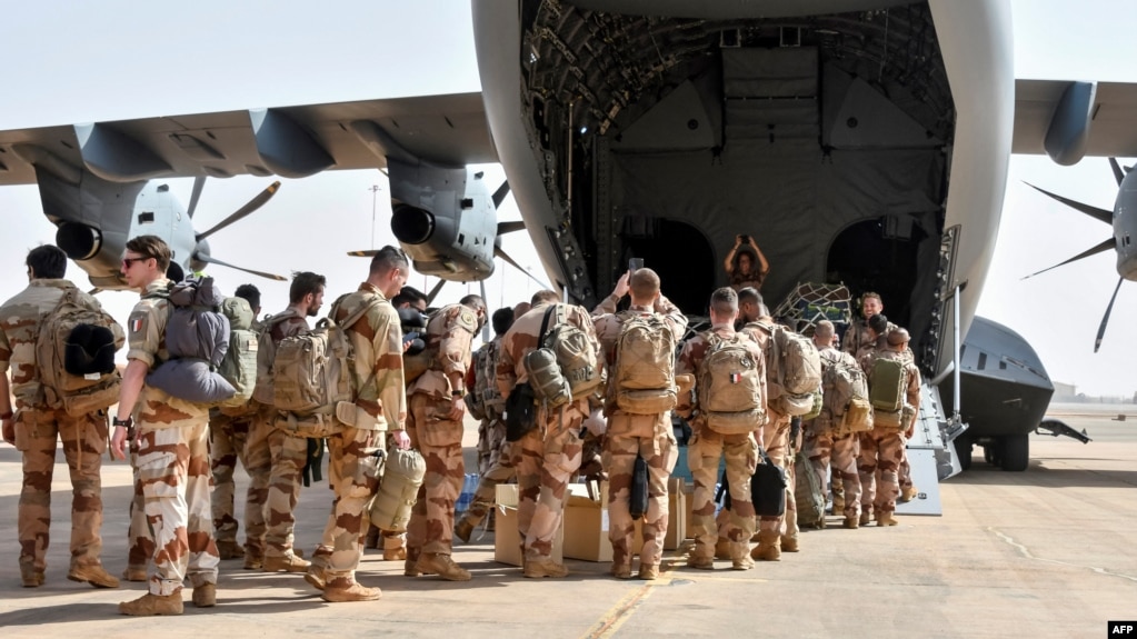 The last French soldiers board a military plane to leave Niger for good, at the French base that was handed over to the Nigerien army, in Niamey on Dec. 22, 2023.