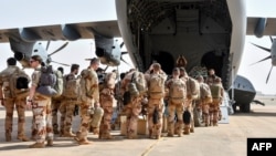 FILE - The last French soldiers board a French military plane to leave Niger for good, at the French base which was handed over to the Nigerien army, in Niamey, Niger, on Dec. 22, 2023.