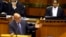 FILE - South African President Jacob Zuma answers questions from opposition party members during a parliamentary session in Cape Town, South Africa, March. 17, 2016. On Tuesday, Zuma survived a move by his own party to oust him as president.