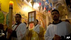 Christian clergymen participate in the Easter Sunday procession at the Church of the Holy Sepulchre, traditionally believed by many to be the site of the crucifixion and burial of Jesus Christ, in Jerusalem's Old City, Israel, March 27, 2016.