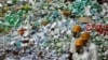 FILE - Workers prepare to destroy more than 50 tons of confiscated fake medicine during a campaign to mark World Consumer Rights Day in Beijing, March 15, 2012.