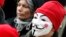 FILE - A protester wears a Guy Fawkes mask during a demonstration in Carhaix, western France, Nov. 30, 2013. 