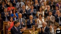 Spain's caretaker Prime Minister Pedro Sánchez (Bottom-L) is applauded by Socialist party colleagues during the parliamentary debate at the Spanish parliament in Madrid, Spain, July 22, 2019.