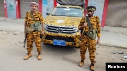 FILE - Houthi-allied police secure a street in Hodeida, Yemen, Dec. 31, 2018.