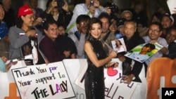 Cast member Michelle Yeoh greets fans on the red carpet for the film "The Lady" during the 36th Toronto International Film Festival (TIFF) September 12, 2011.