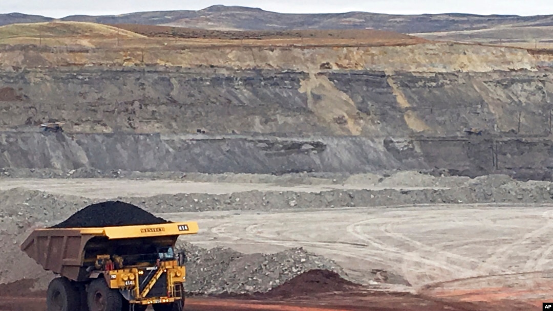 FILE - A dump truck hauls coal at Contura Energy's Eagle Butte Mine near Gillette, Wyo., March 28, 2017. Mine owner Blackjewel says it has filed for Chapter 11 bankruptcy protection. It operates mines in Wyoming, Kentucky, Virginia and West Virginia.