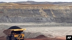 FILE - A dump truck hauls coal at Contura Energy's Eagle Butte Mine near Gillette, Wyo., March 28, 2017. Mine owner Blackjewel says it has filed for Chapter 11 bankruptcy protection. It operates mines in Wyoming, Kentucky, Virginia and West Virginia.