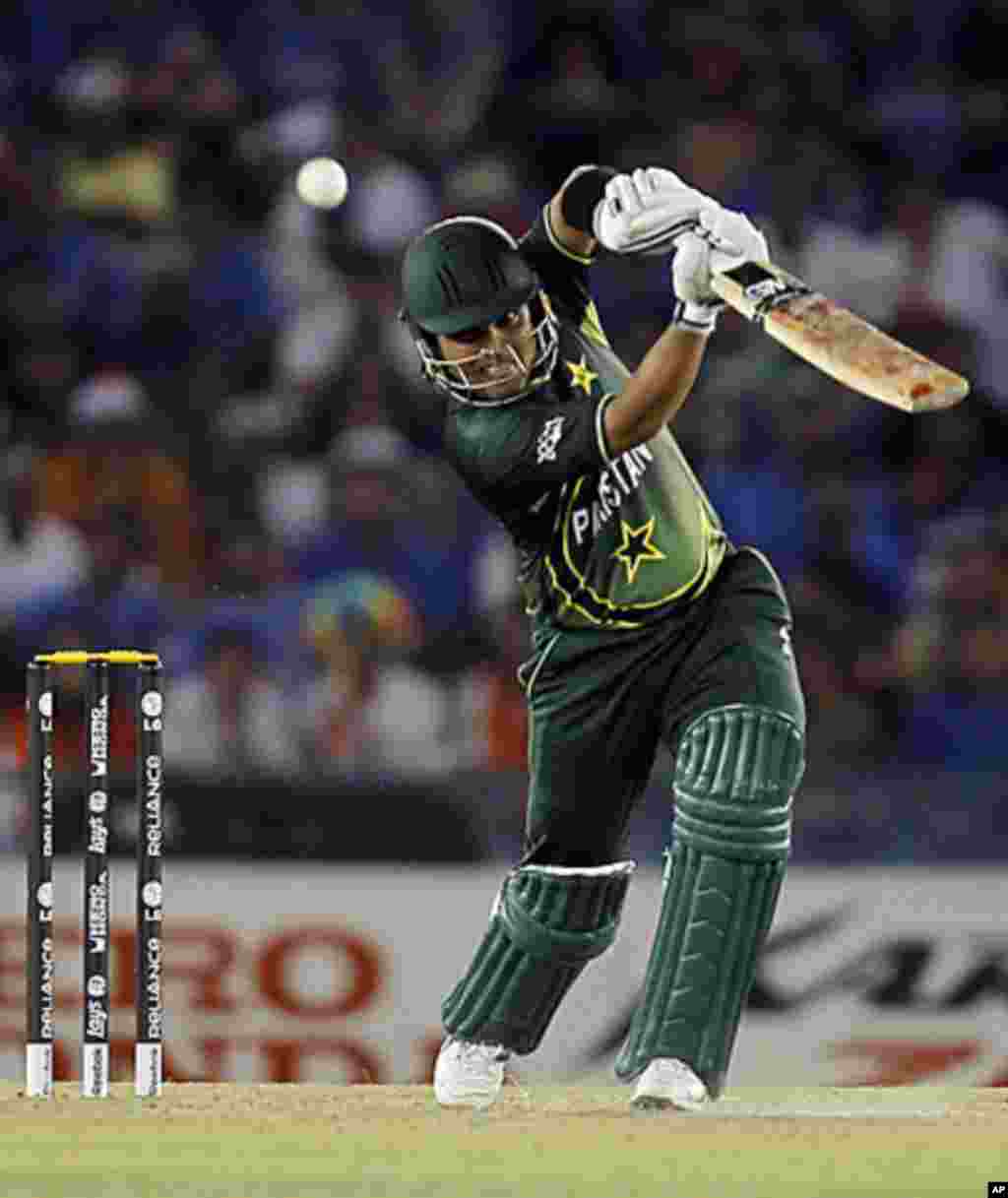 Pakistan's Kamran Akmal plays a shot during the ICC Cricket World Cup 2011 semi-final match against India in Mohali March 30, 2011.