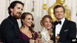 Academy Award winners for best supporting actor Christian Bale, best actress Natalie Portman, best supporting actress Melissa Leo and best actor Colin Firth (L-R) pose backstage at the 83rd Academy Awards in Hollywood, California on Feb. 27, 2011.