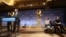 Hollywood Foreign Press Association President Theo Kingma speaks at the podium as (L-R) actors Zoe Saldana, Aziz Ansari and Olivia Wilde sit on stage at the announcement of nominations for the 71st annual Golden Globe Awards in Beverly Hills, California, 