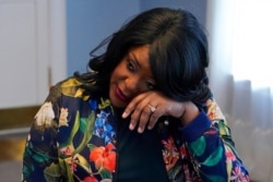 FILE - Tiffany Crutcher wipes tears away during an interview in Tulsa, Okla., April 12, 2021. In 2016, Tulsa police officer Betty Shelby shot and killed Crutcher’s twin brother, Terence Crutcher. Shelby, who is white, was acquitted of manslaughter.