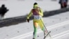 Togo's Mathilde Amivi Petitjean crosses the finish line of the women's 10K classical-style cross-country race at the 2014 Winter Olympics, Thursday, Feb. 13, 2014, in Krasnaya Polyana, Russia.