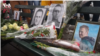 Supporters of late Russian opposition leader Alexei Navalny leave flowers and photographs at memorial events in major U.S. cities, in this screen grab from a VOA Russian video.