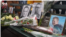 Supporters of late Russian opposition leader Alexei Navalny leave flowers and photographs at memorial events in major U.S. cities, in this screen grab from a VOA Russian video.