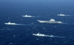 FILE - This photo taken Jan. 2, 2017, shows a Chinese navy formation during military drills in the South China Sea. On Jan. 27, 2021,