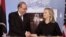 Secretary of State Hillary Clinton shakes hands with Libya's Prime Minister Abdurrahim el-Keib, March 8, 2012, at the State Department in Washington