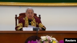 Im Chhun Lim, President of the Constitutional Council of Cambodia, announces the election disqualification of the Candlelight Party for the upcoming election in Phnom Penh