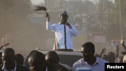 Kenyan opposition leader Raila Odinga, the presidential candidate of the National Super Alliance (NASA) coalition, waves to supporters as he leaves from their campaign rally at the Kamukunji grounds in Nairobi, July 7, 2017.