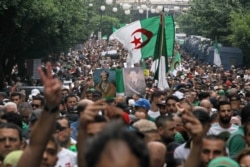 FILE - Algerians invade the streets during a demonstration in Algiers, Sept. 20, 2019.