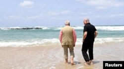 Israel's Prime Minister Benjamin Netanyahu (R) walks with India's Prime Minister Narendra Modi as they visit Olga Beach and a water desalination unit operated by G.A.L. Water Technologies, near Hadera, Israel, July 6, 2017.