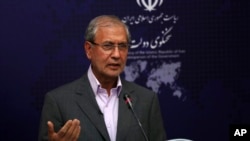 FILE - Iran's government spokesman Ali Rabiei speaks in his regular news briefing, July 22, 2019.