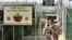 FILE - U.S. military guards enter the Camp Delta military-run prison at the Guantanamo Bay U.S. Naval Base, Cuba. 