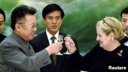 FILE - Former North Korean Leader Kim Jong Il toasts former U.S. Secretary of State Madeleine Albright at a 2000 dinner in Pyongyang. The U.S.-North Korea nuclear agreement struck during the Bill Clinton administration fell apart after Clinton left office. 