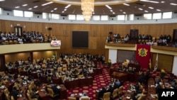 FILE - Lawmakers gather at Ghana's parliament, in Accra, July 31, 2019.