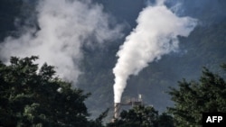 FILE — A factory chimney smokes at the industrial complex of Cubatao, Sao Paulo state, Brazil, on November 4, 2021. Brazil's emissions surged under ex-president Jair Bolsonaro, a report said Thursday, November 23, 2023.