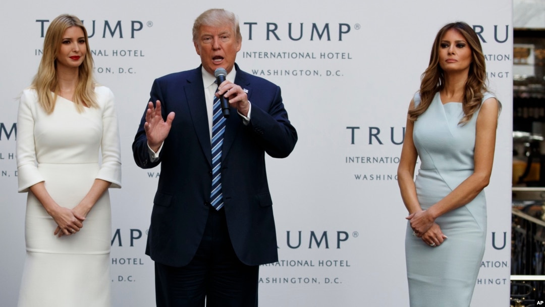 Republican presidential candidate Donald Trump, accompanied by, from left, Ivanka Trump and Melania Trump, speaks during grand opening of Trump International Hotel-Old Post Office, Oct. 26, 2016, in Washington.