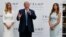 Republican presidential candidate Donald Trump, accompanied by, from left, Ivanka Trump and Melania Trump, speaks during grand opening of Trump International Hotel-Old Post Office, Oct. 26, 2016, in Washington.