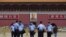 Police officers wearing face masks following the COVID-19 outbreak stand in Tiananmen Square ahead of the upcoming National People's Congress (NPC), in Beijing, China May 20, 2020.
