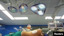 FILE - A U.S. heart patient is prepared for a two-hour surgery at Bangkok Heart Hospital in Bangkok.