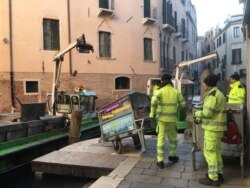 The total damage caused by November's winds and high tides has been estimated at over $500 million with the clean-up a work in progress. (Sabina Castelfranco/VOA)