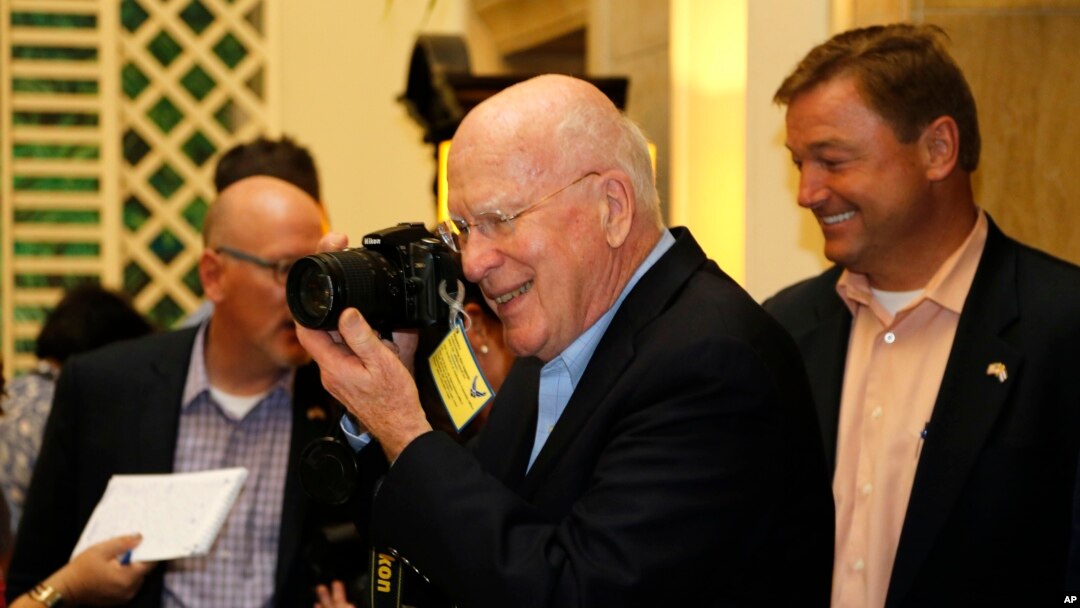 Sen. Patrick Leahy, D-Vt. turns his camera on reporters after a news conference in Havana, Cuba, June 27, 2015.
