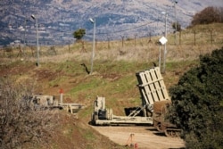 FILE - An Iron Dome anti-missile system is seen near the border area between Israel and Syria, in the Israeli-occupied Golan Heights, Nov. 18, 2020.