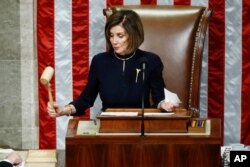 House Speaker Nancy Pelosi strikes the gavel after announcing the passage of the second article of impeachment against President Donald Trump, Dec. 18, 2019, on Capitol Hill in Washington.