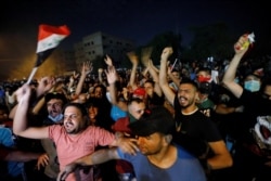 Demonstrators gather at a protest during a curfew, two days after the nationwide anti-government protests turned violent, in Baghdad, Iraq, Oct. 3, 2019.